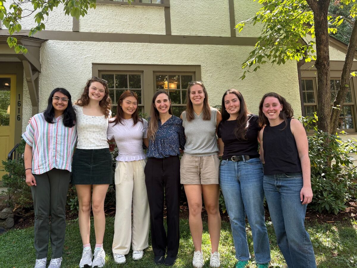 NEST Lab members standing together on the lawn outside the lab